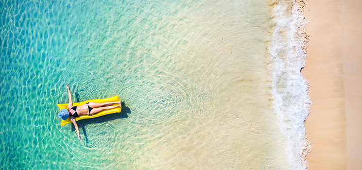 person floating on water